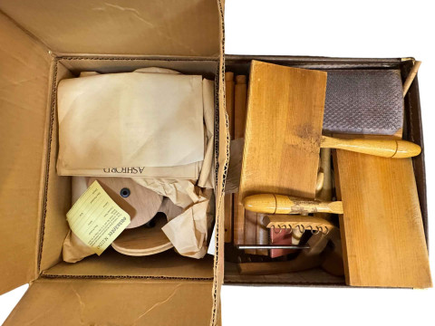 Two wooden spinning wheels and a case of accessories. thumbnail