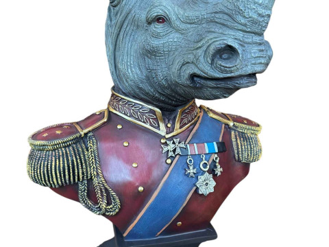 A large composite gentry rhino bust on square base.