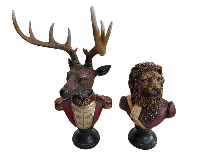 A gentry stag bust on round base and a gentry lion bust on round base.