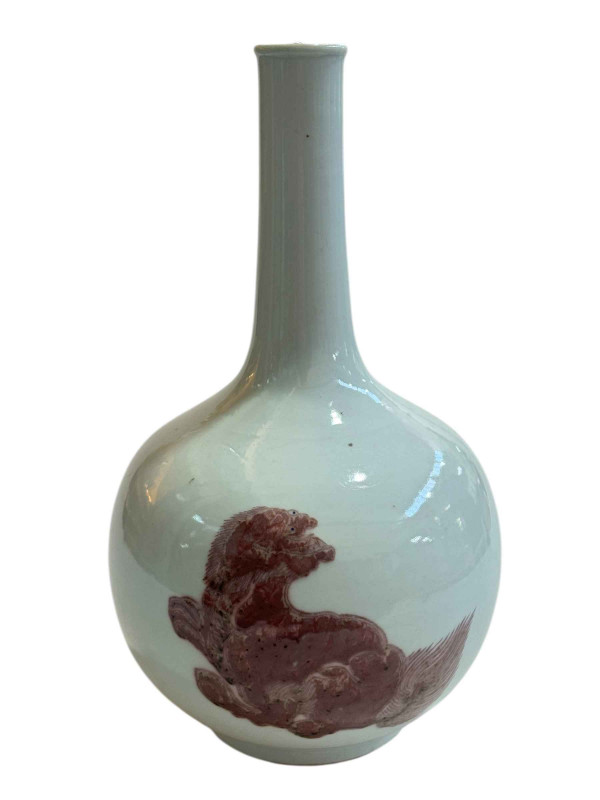 A large Chinese bottle vase painted with foo dogs on white ground, 35cm high.
