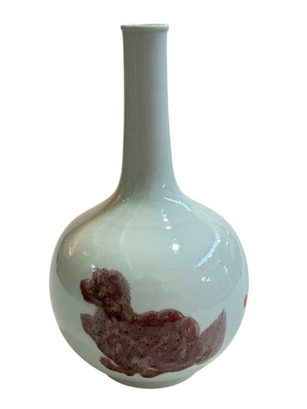A large Chinese bottle vase painted with foo dogs on white ground, 35cm high.