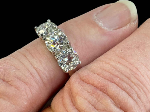 Platinum set three-stone diamond ring, diamonds totalling 2.70ct, size L, with Gemological Institute certificate. thumbnail