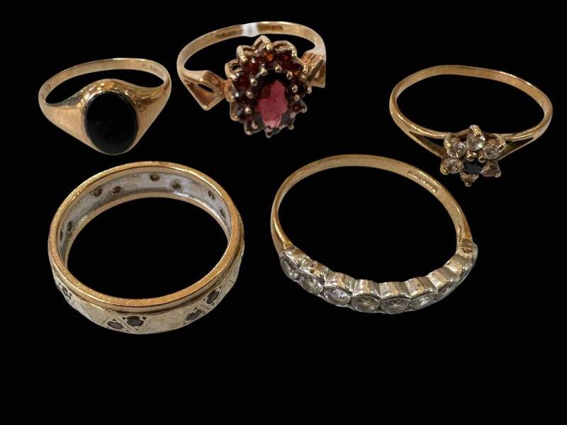 Collection of five 9 carat gold gem set rings.