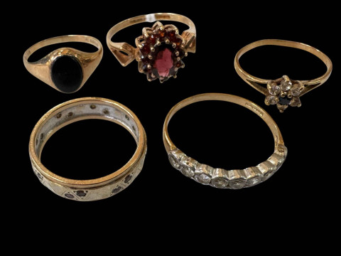 Collection of five 9 carat gold gem set rings.