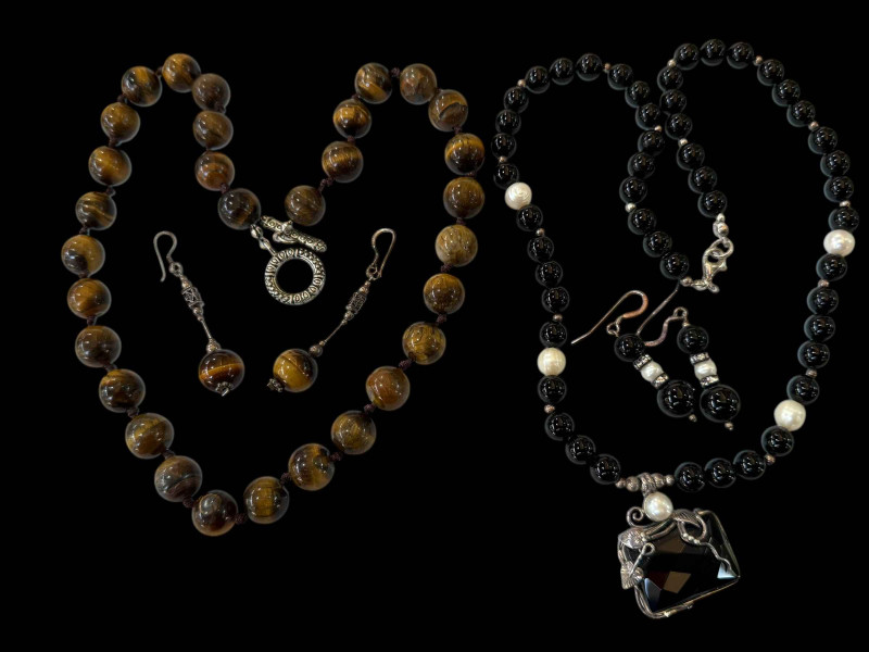 Silver mounted black bead and pearl necklace and earrings and tiger's eye necklace and earrings set (2).