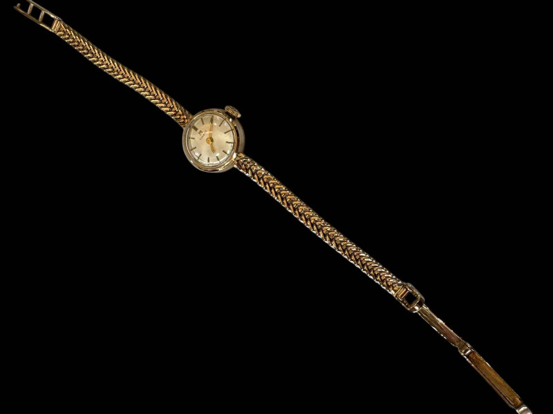 Tissot lady's 9 carat gold bracelet watch.