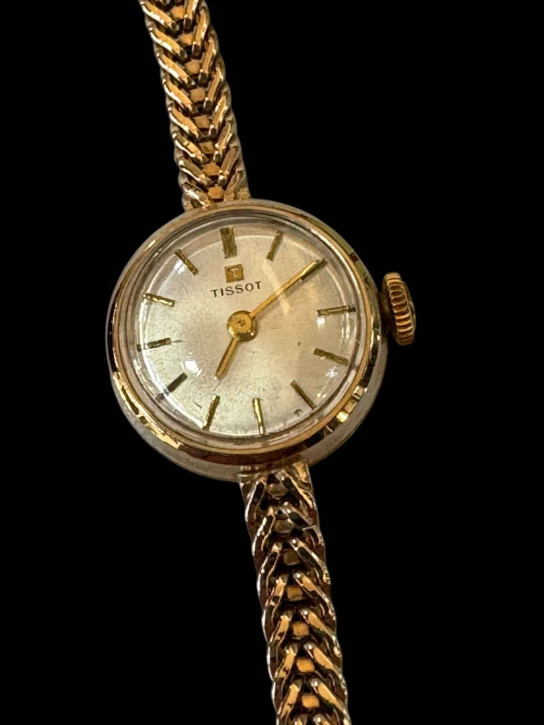 Tissot lady's 9 carat gold bracelet watch.
