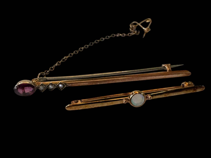 Two 9 carat gold bar brooches, one opal and one amethyst.