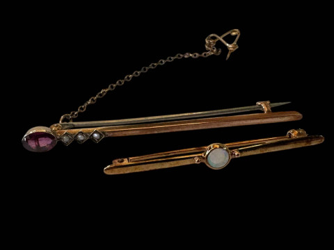 Two 9 carat gold bar brooches, one opal and one amethyst.