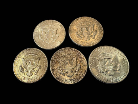 Five silver half dollars. thumbnail