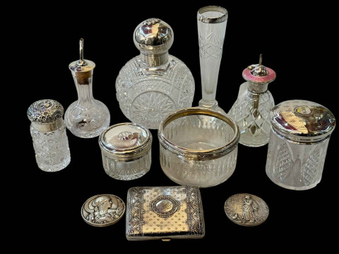 Collection of eleven mostly silver mounted toilet and scent bottles, also...