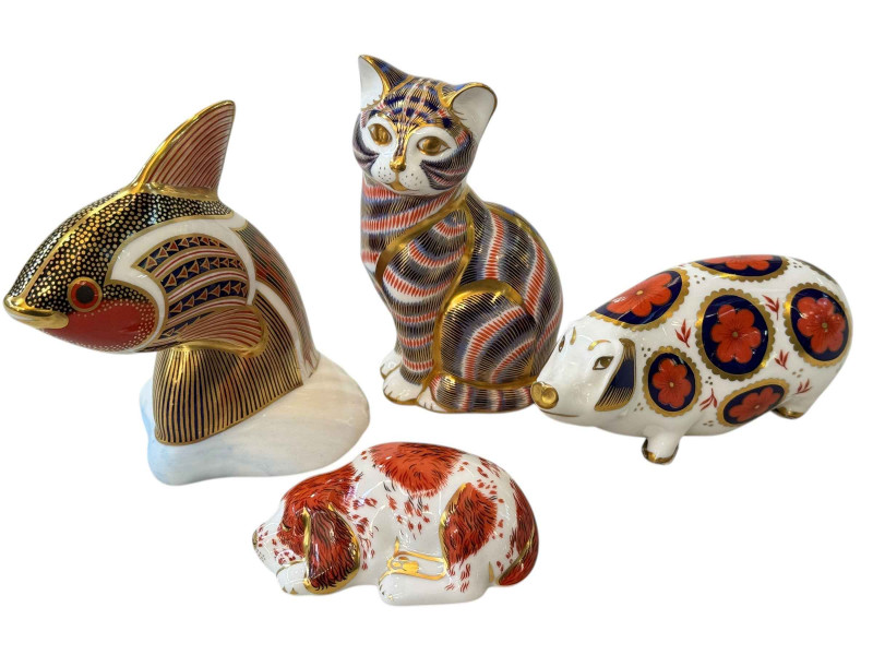 Four Royal Crown Derby paperweights.