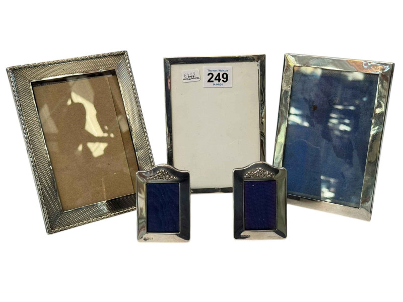 Collection of five silver photograph frames, tallest 17 by 12cm.