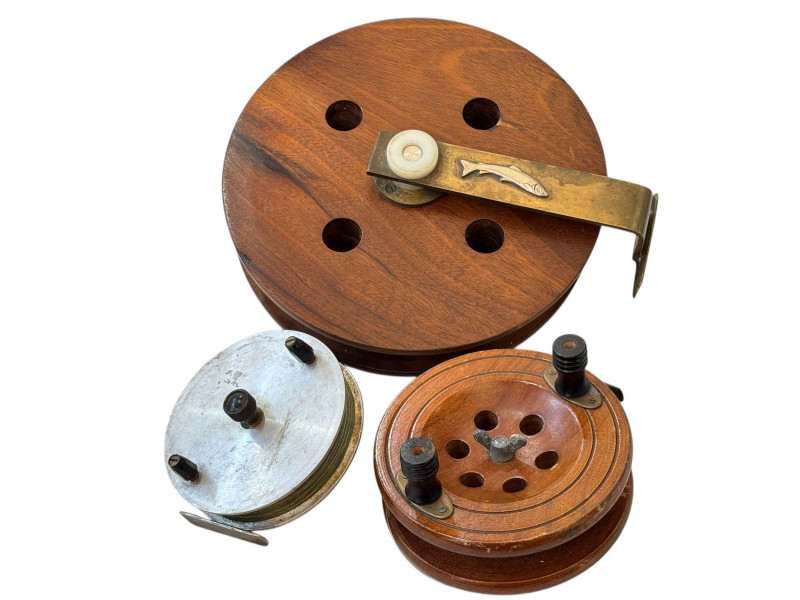 Three fishing reels, including large mahogany fishing reel with silver fish mount.