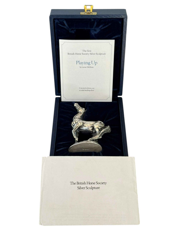 Lorne McKean silver horse sculpture Playing Up, a limited edition for The British Horse Society, boxed and with certificate and letter from John Pinches Limited, 11.5cm.