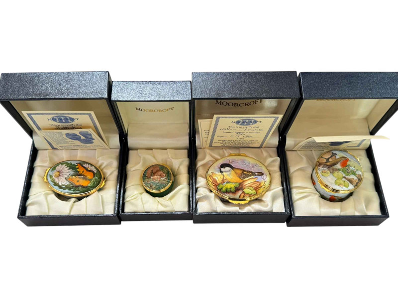 Moorcroft enamels trinket boxes including Willow Titmouse, Last Snow of Winter, Butterflies and Squirrels.