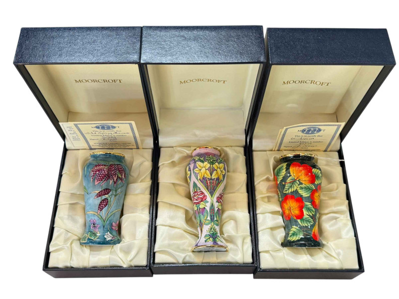 Three Moorcroft enamel vases St Lucia 90/150 with certificate, Wild Spring Flowers 71/250 with certificate and Golden Jubilee no certificate.