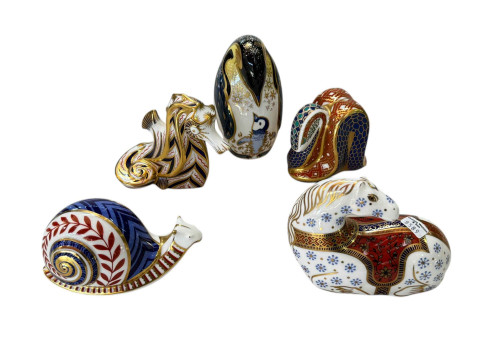 Five Royal Crown Derby paperweights including Penguin, Seahorse, Snake,...