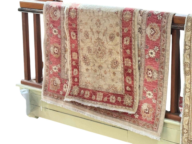 Floral pattern fawn and red ground carpet, 2.5 by 1.50 and similar carpet runner, 4.20 by 0.85.