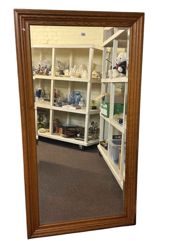 Oak framed rectangular bevelled wall mirror, 171 by 91cm, including frame.