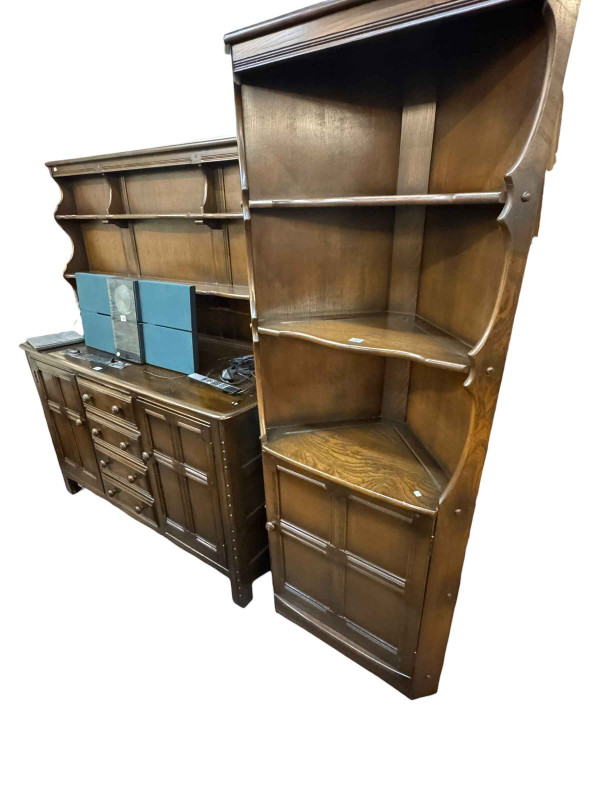 Eight piece suite of Ercol Old Colonial comprising shelf back dresser, open topped standing corner cabinet, rectangular dining table, set of four Goldsmith dining chairs and plate rack together with a pair of tapestry seated carver chairs and stool (11).