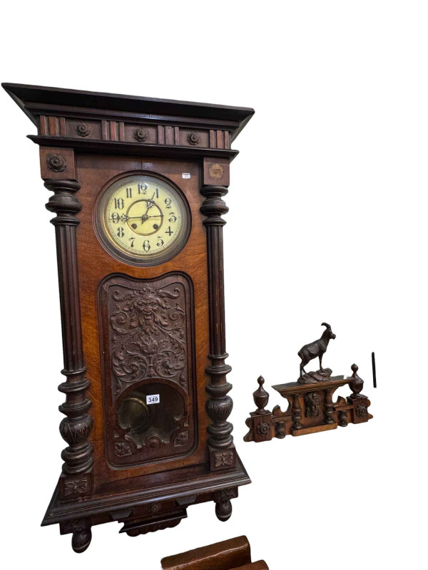 Victorian walnut cased Vienna wall clock having green man mask carved door.