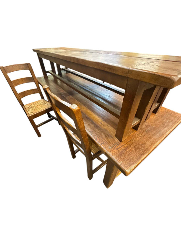 Continental rustic style eight piece dining suite comprising waterfall shelf back dresser, rectangular two drawer dining table, pair jointed benches and four rush seated chairs.