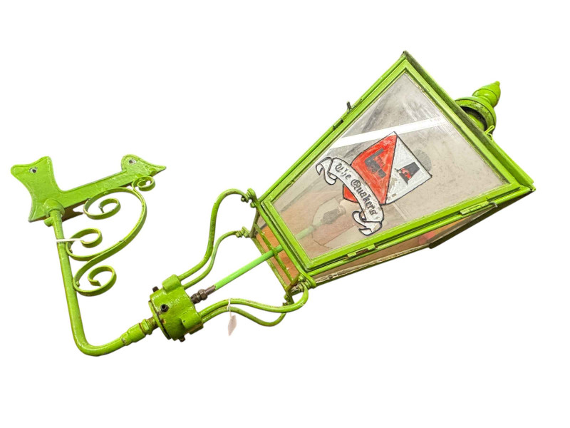 Green painted copper lantern and cast iron wall bracket converted for electricity.