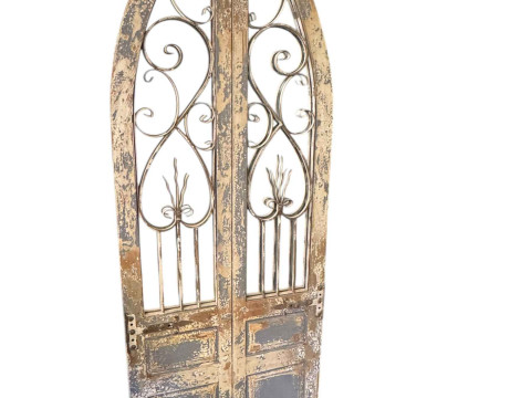 French style arched top mirror in the form of a door.
