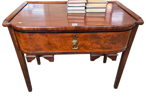 19th Century mahogany bow front side/writing table having single deep...