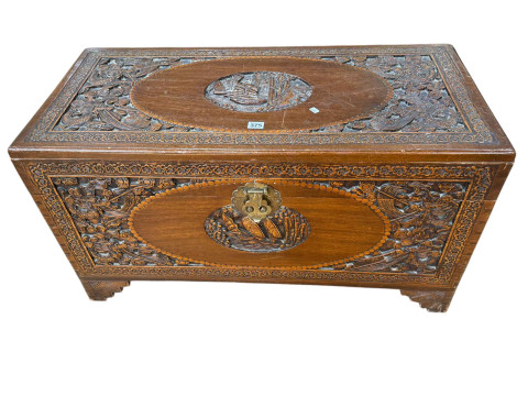 Oriental carved camphorwood trunk, 51cm by 94cm by 44cm.