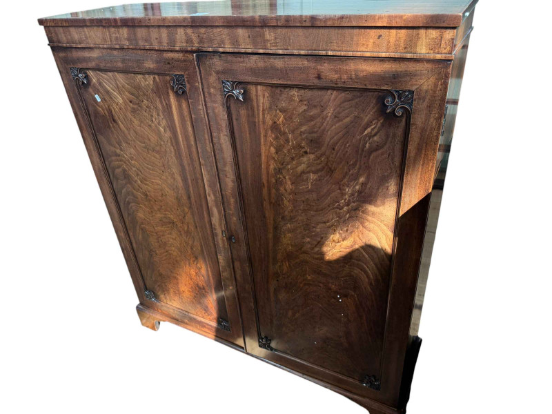 Victorian mahogany cabinet having two panelled doors enclosing a glazed fall front door above two adjustable shelves, 121cm by 107cm by 32.5cm.
