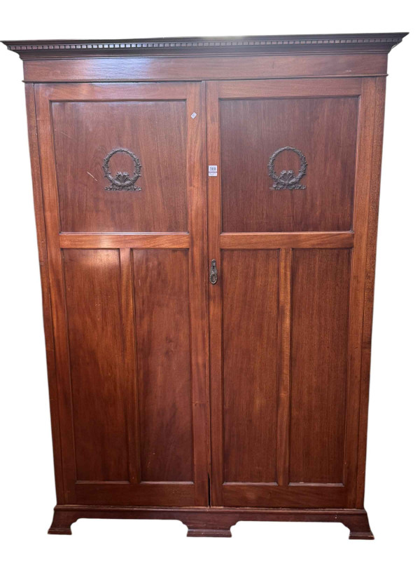 1920's mahogany two door fitted wardrobe, 203cm by 145cm by 52cm.