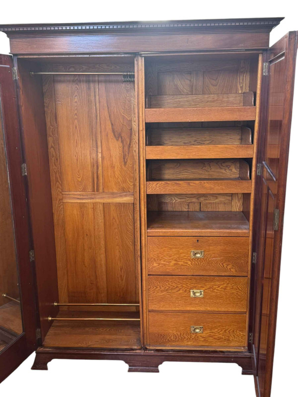 1920's mahogany two door fitted wardrobe, 203cm by 145cm by 52cm.