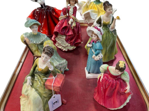 Eight Royal Doulton figures including Ascot and Carrie.