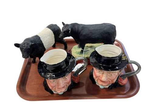 Two Border Fine Arts bulls and two Beswick toby jugs.