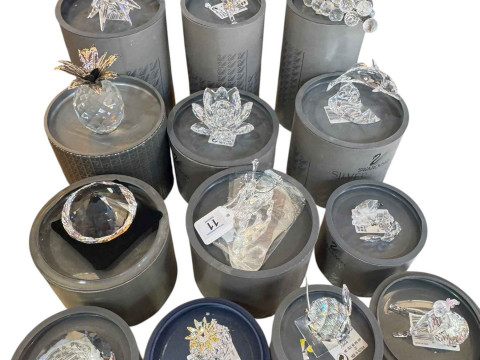 Swarovski; Thirteen pieces with boxes including stag, grapes and tiger.