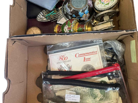 Two boxes with coins and collectables.