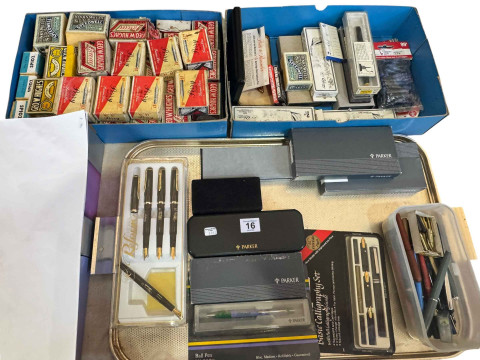 Collection of pens and vintage pen nibs.