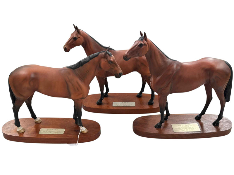 Three Beswick racehorses on wooden plinths, Arkel, Red Rum and Nijinsky.