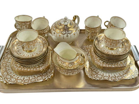 Tuscan china 'Plant' cream and gilt part tea service.