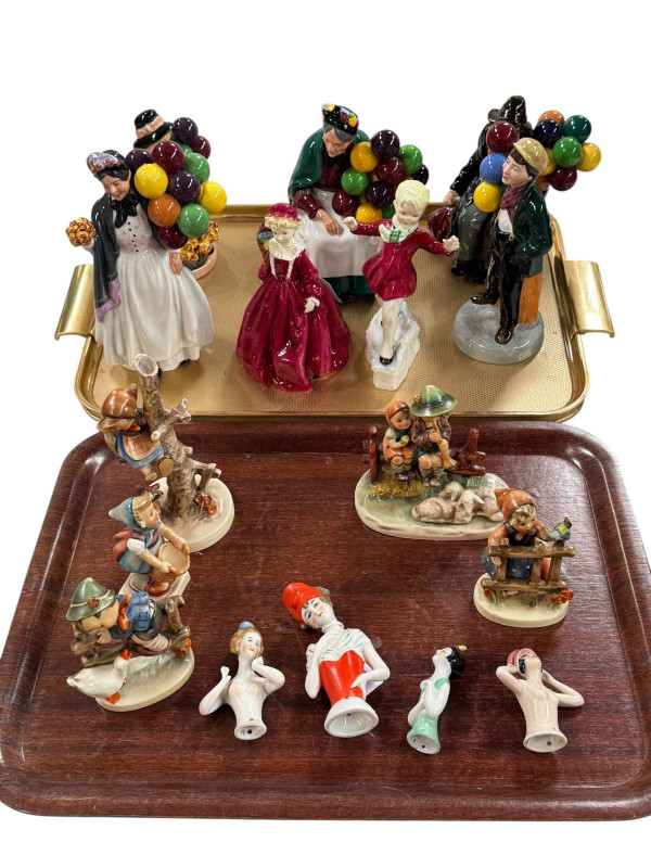 Five Royal Doulton, two Royal Worcester and five Hummel figures, and four pin cushion ladies.
