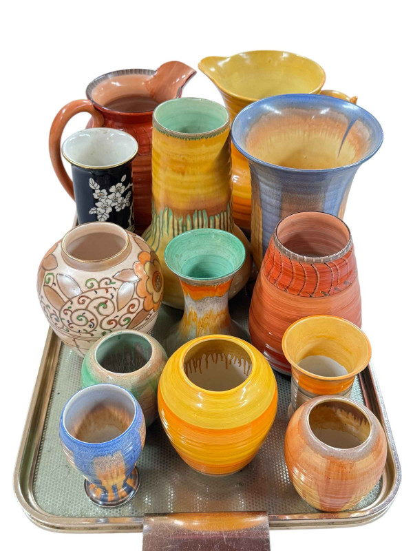 Collection of Shelley jugs and vases and a Charlotte Rhead vase.