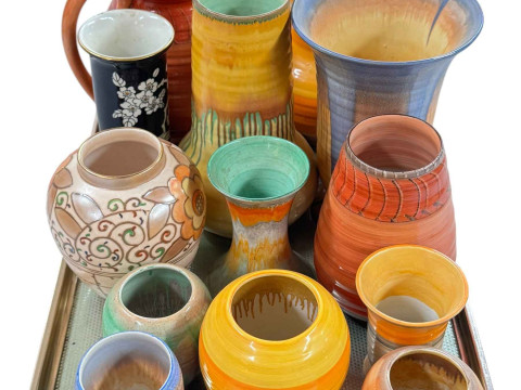 Collection of Shelley jugs and vases and a Charlotte Rhead vase.