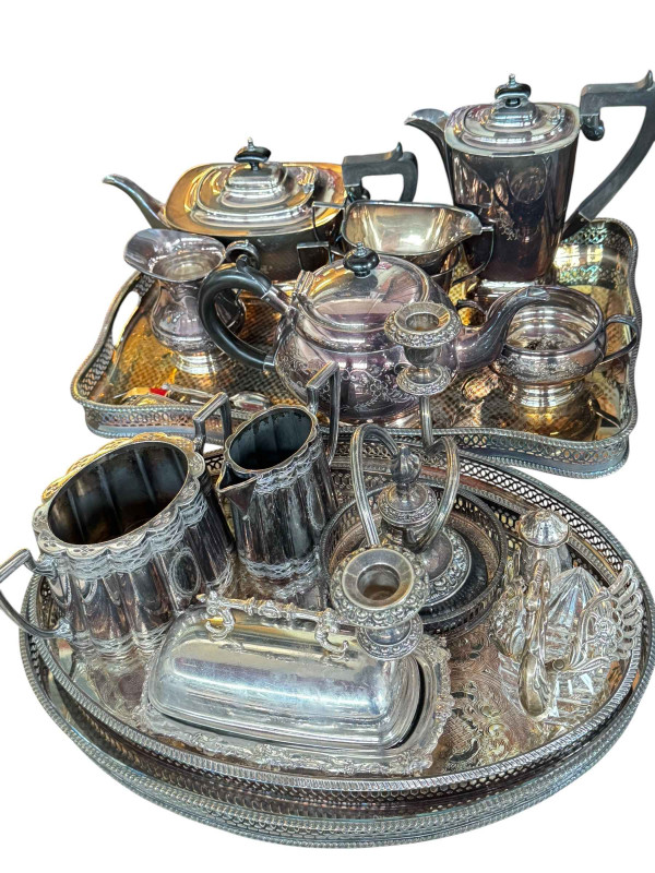 Selection of silver plated ware including a four piece and three tea piece tea service.