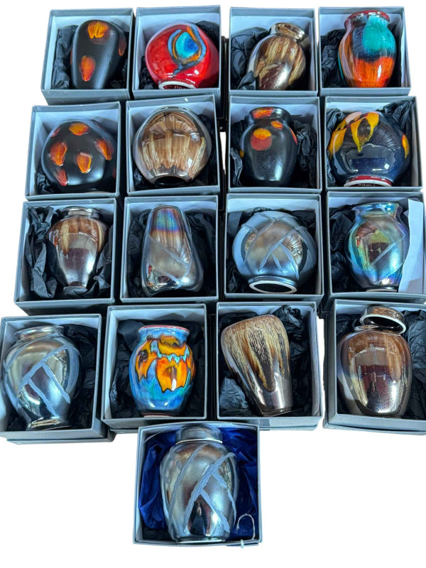 Collection of Poole Pottery vases and ginger jars (all boxed as new).