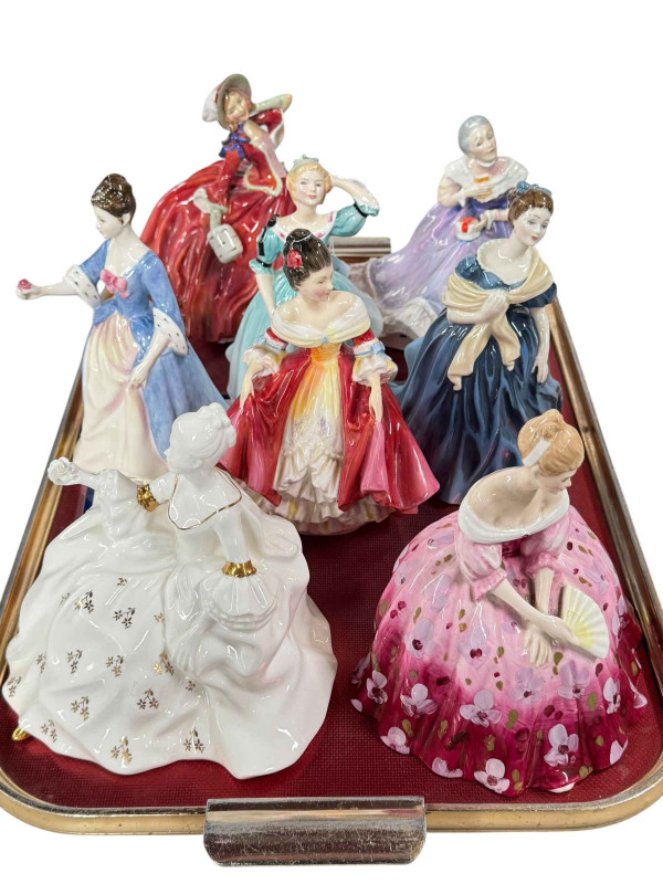 Collection of eight Royal Doulton ladies including Antoinette, Autumn Breezes and Victoria.