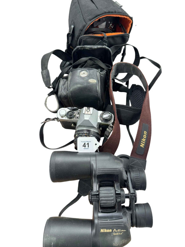 Fuji Film Finepix SL camera, Pentax ME super camera, Camedia digital camera and a pair of Nikon Action 10x50 binoculars.