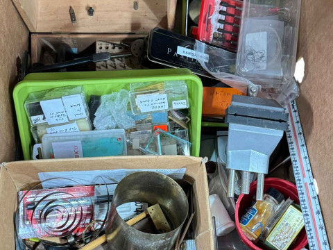 Three boxes of clock parts including movements, clock makers tools and accessories. thumbnail