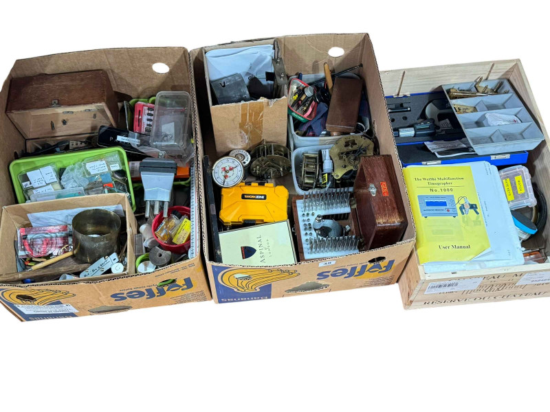 Three boxes of clock parts including movements, clock makers tools and accessories.